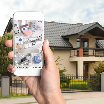 Lubbock vivint phone display of cctv live feed in front of a house